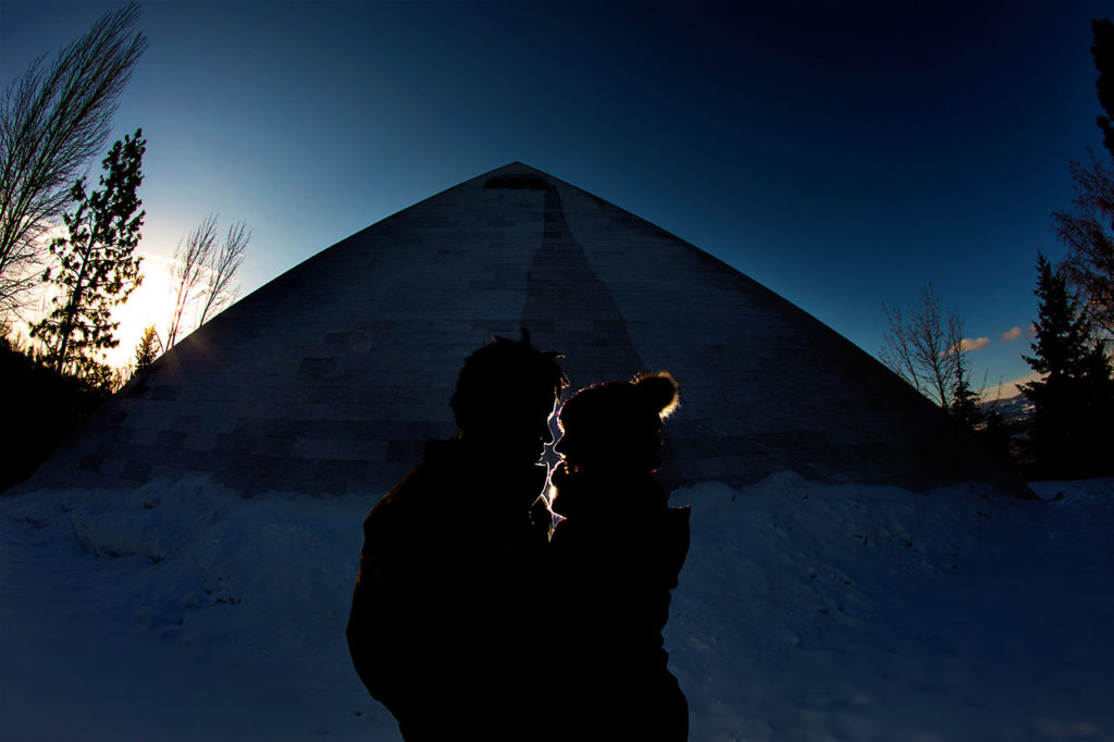 Night Engagement Session of Interracial couple in front of pyramid in Summerhill Winery Kelowna