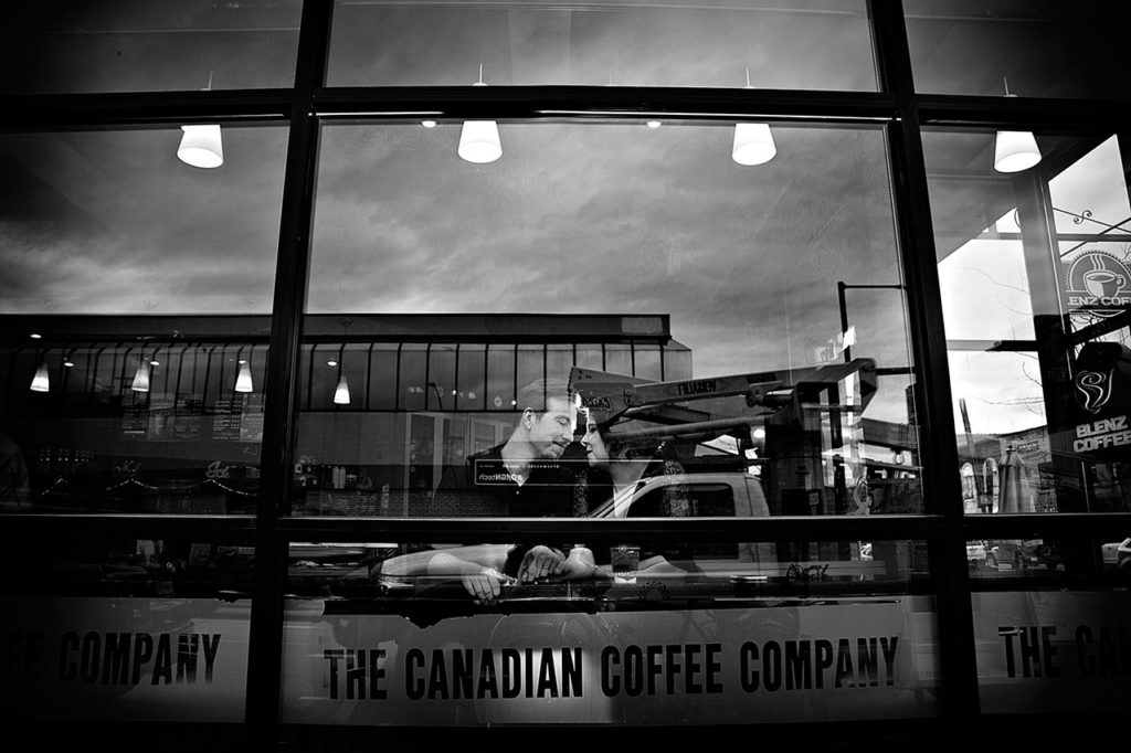 Couple sharing a cup of coffee at Bean Scene in Downtown Kelowna